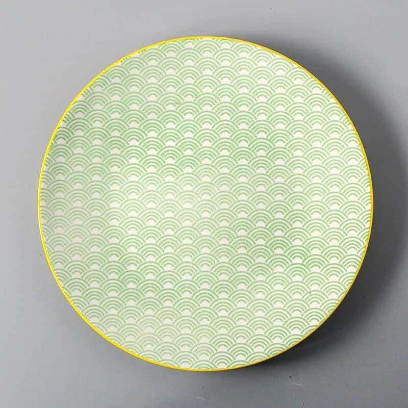 Elegant ceramic plates with vibrant, whimsical prints in a variety of enchanting designs