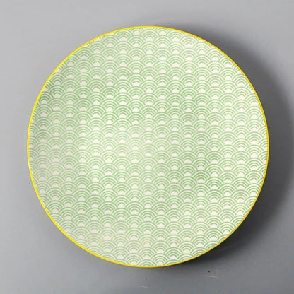 Elegant ceramic plates with vibrant, whimsical prints in a variety of enchanting designs