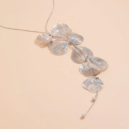 Elegant Kpop-inspired flower petal choker necklace in radiant gold colour, featuring a beautiful pendant and chic snake chain design