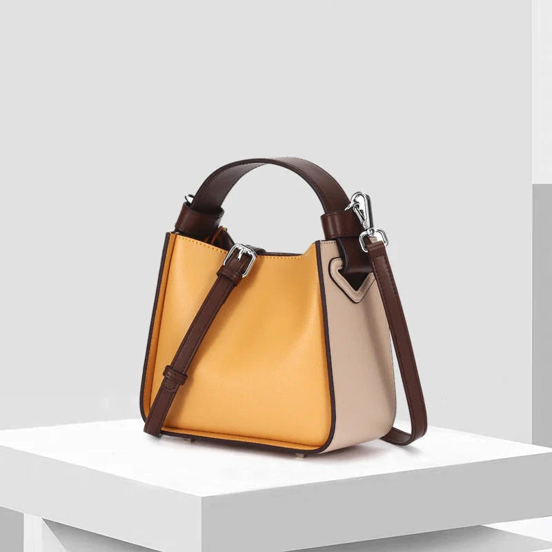 A stylish microfibre leather tote bag with a chic bucket shape and ruched detailing, perfect for the modern British woman.