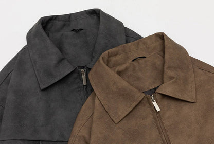 A classic distressed leather jacket in a relaxed, unstructured fit suitable for both men and women