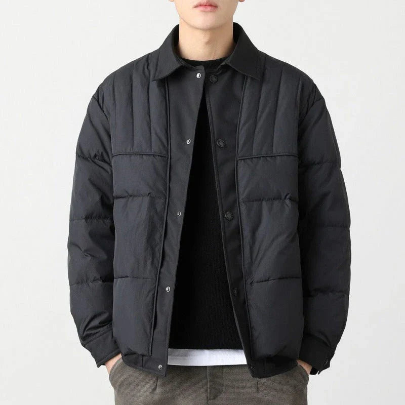 A premium lightweight down jacket in a sleek, tailored design for the stylish British gentleman