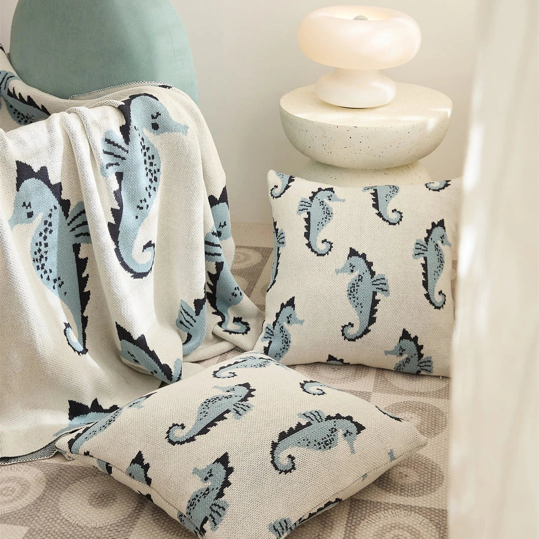 Soft and cosy 100% cotton blanket with a charming sea horse design, perfect for relaxation at home or on the go.