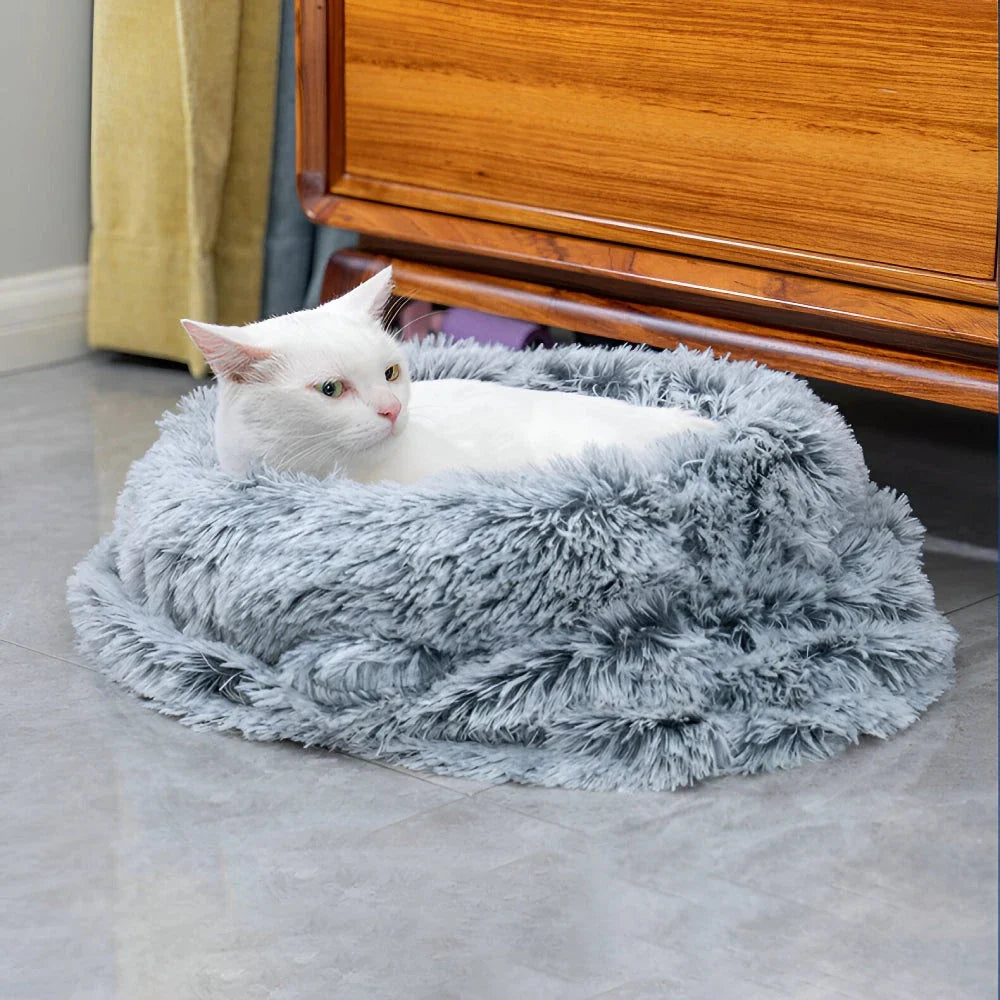 Cosy plush pet sleeping bag in grey colour, designed to keep small pets warm and comfortable