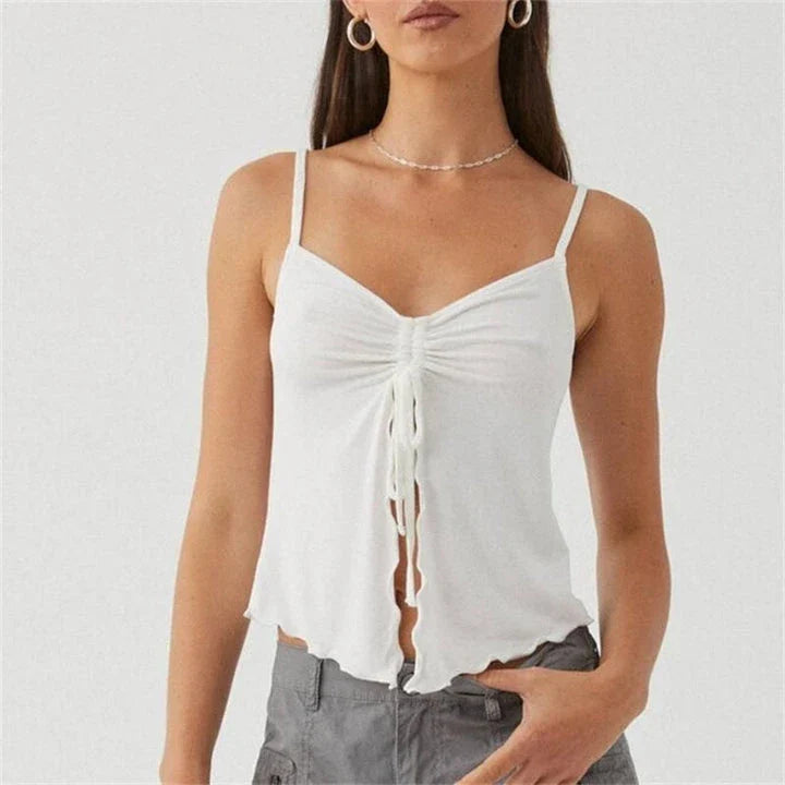 Chic white sleeveless crop top with side bandage detail, perfect for summer fashion
