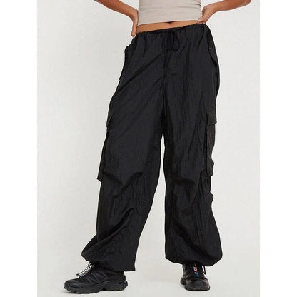 Stylish high-waist safari-inspired cargo trousers for women in black, featuring a comfortable, flattering fit and practical pockets.