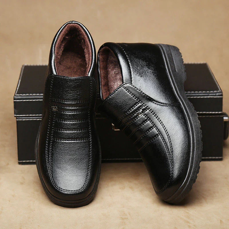 Premium cotton leather men's ankle boots in black and brown, featuring plush lining and durable rubber sole for warmth and stability in cold weather