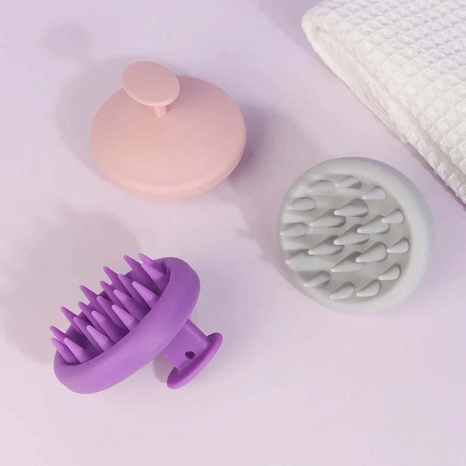 A green silicone scalp massager with soft bristles, designed to provide a soothing hair washing experience and promote healthy hair growth.