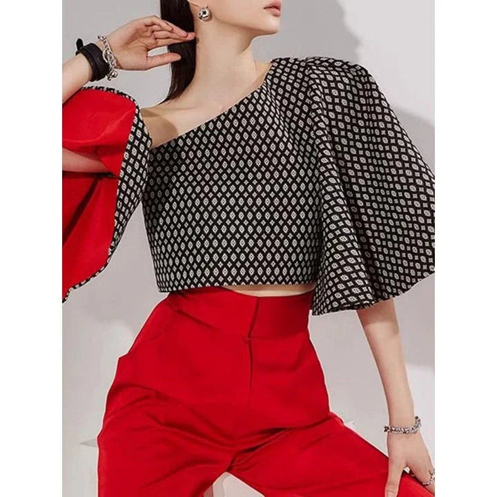 Elegant off-shoulder blouse with butterfly sleeves and vibrant printed pattern