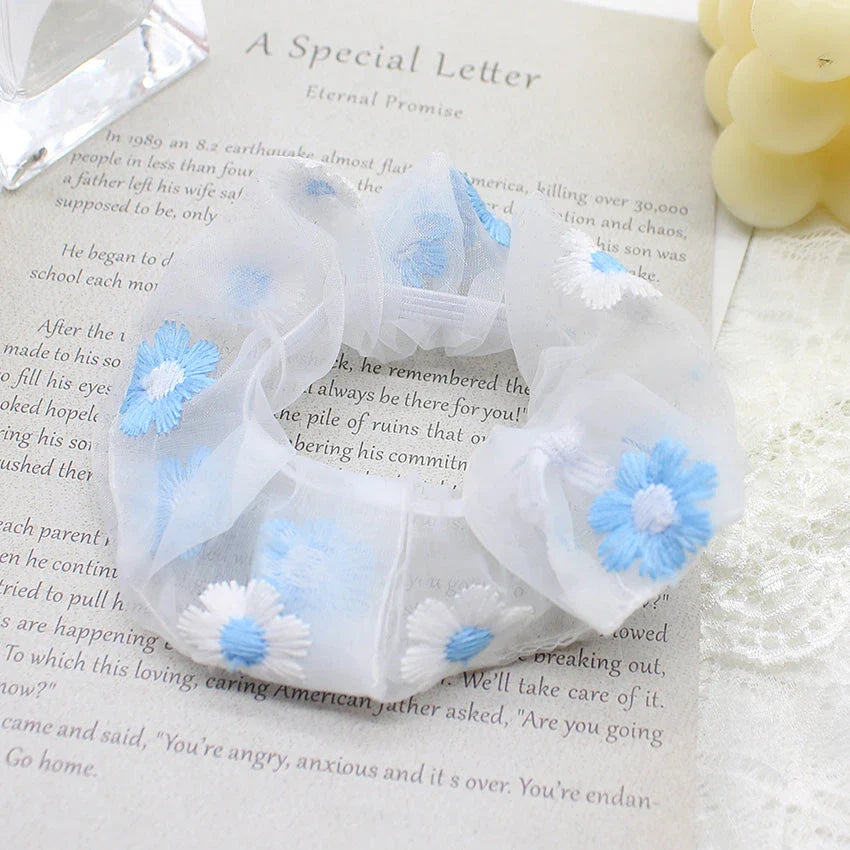 Handmade floral elastic hair bands with soft chiffon fabric and vibrant embroidered daisy patterns, perfect for enhancing everyday style in the UK.
