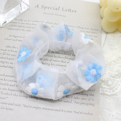Handmade floral elastic hair bands with soft chiffon fabric and vibrant embroidered daisy patterns, perfect for enhancing everyday style in the UK.