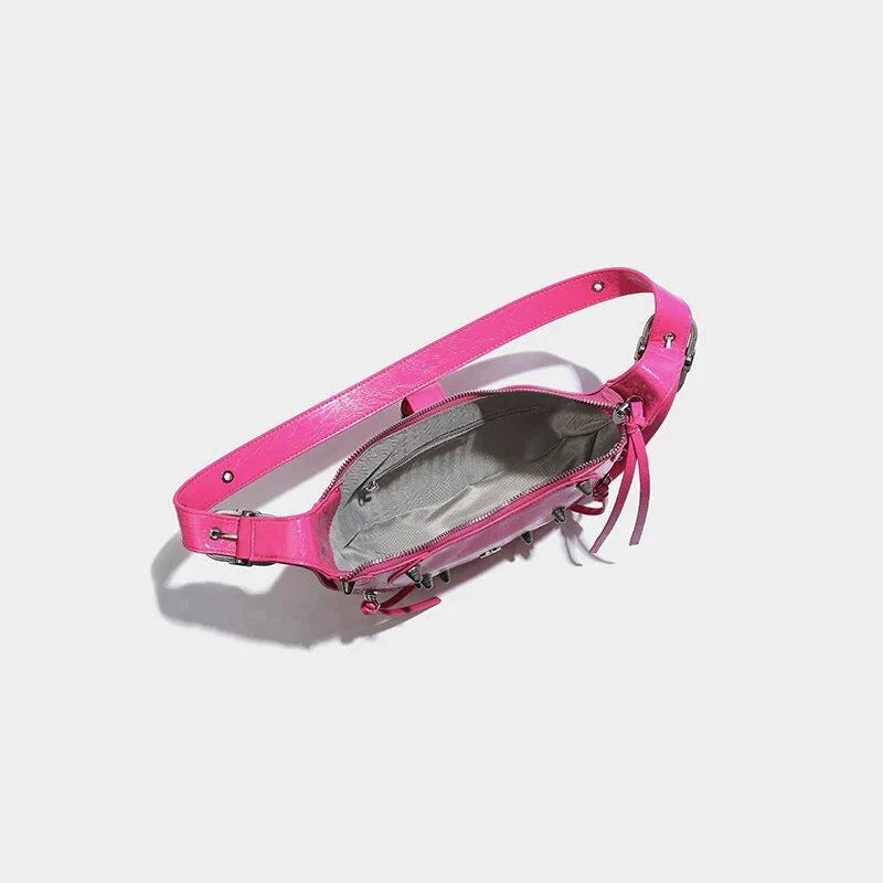 Stylish pink leather sling crossbody daypack with adjustable strap and smooth zipper closure