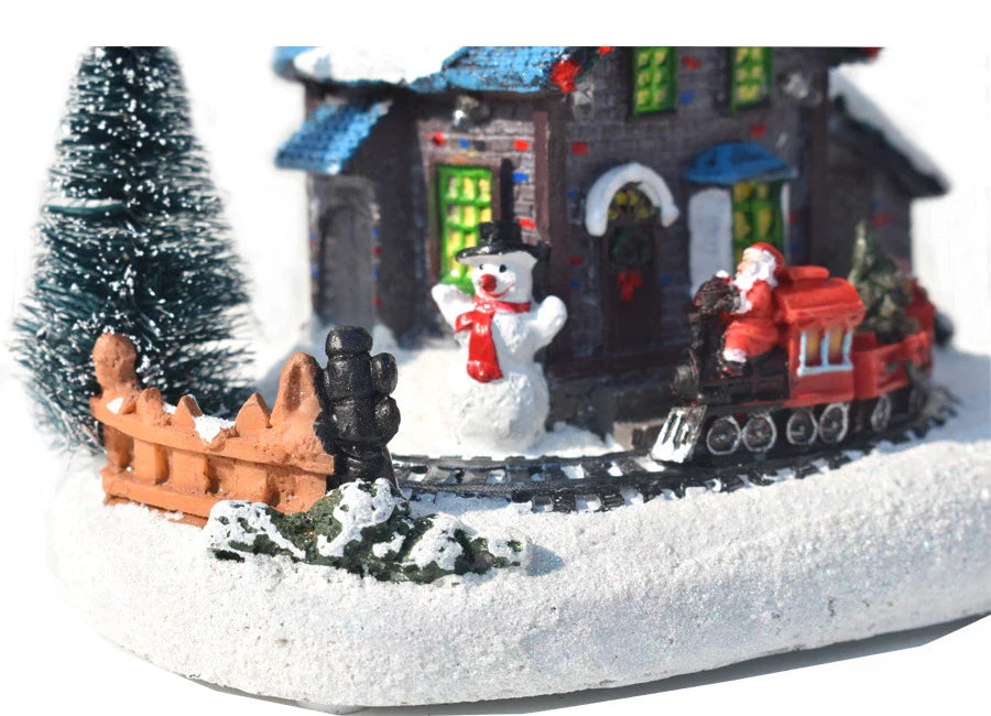 Luminous Christmas house decorations made of resin, with a warm glowing light creating a festive winter scene