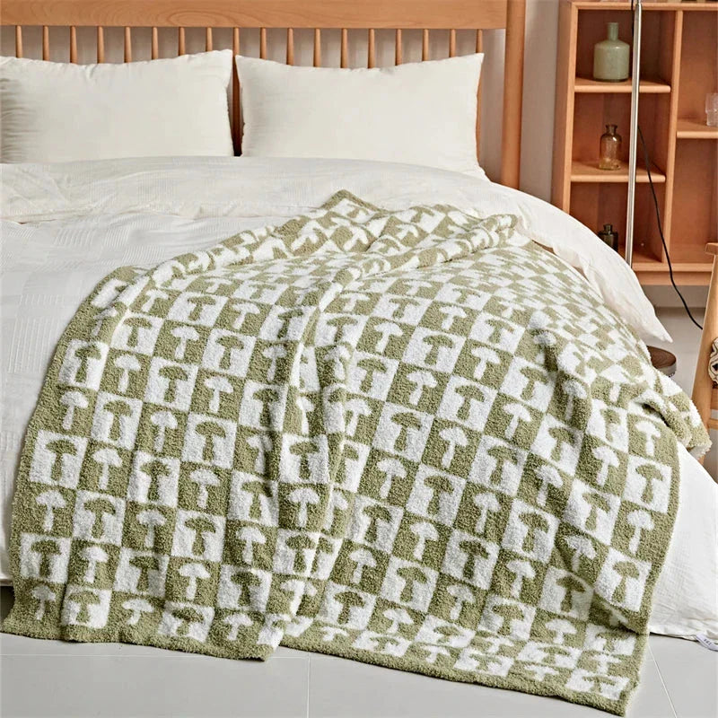 Cosy two-tone checkerboard plaid knitted throw blanket in various colours, including red, blue, grey, and purple