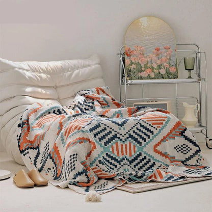 Boho geometric design cotton blanket in various sizes, perfect for indoor and outdoor use