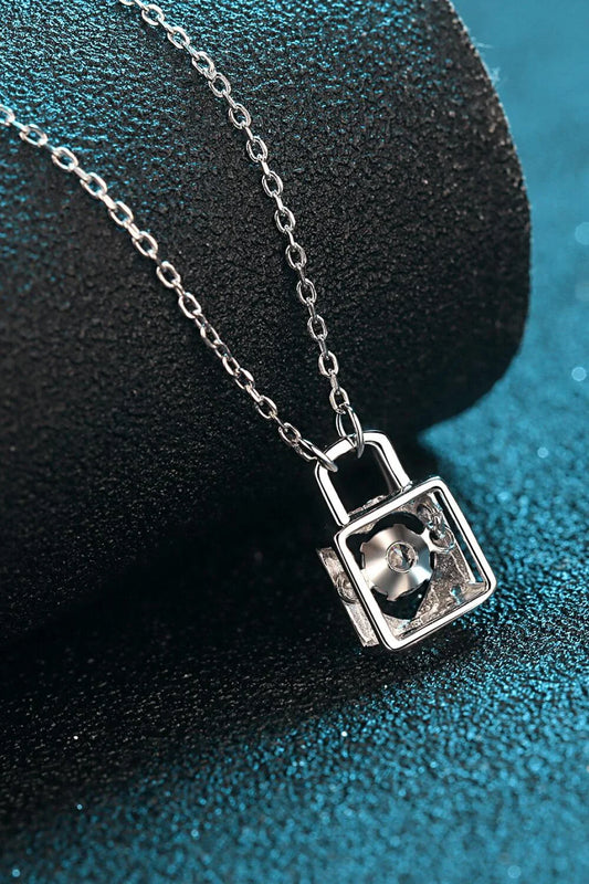 Elegant sterling silver moissanite lock pendant necklace with a minimalist, modern design