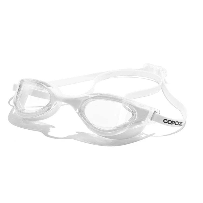 Premium British-made swimming goggles with anti-fog and UV protection technology, designed for clear visibility and comfort in pools, beaches, and water parks.