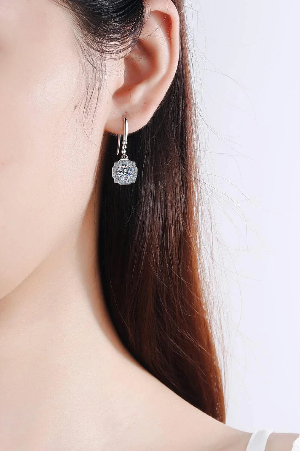 Pair of 925 sterling silver earrings featuring sparkling moissanite stones and zircon accents