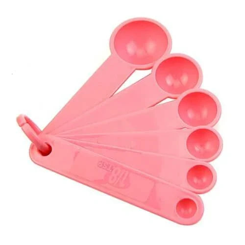 A set of 10 pink baking measurement cups and spoons made from food-grade plastic for precise ingredient measurements