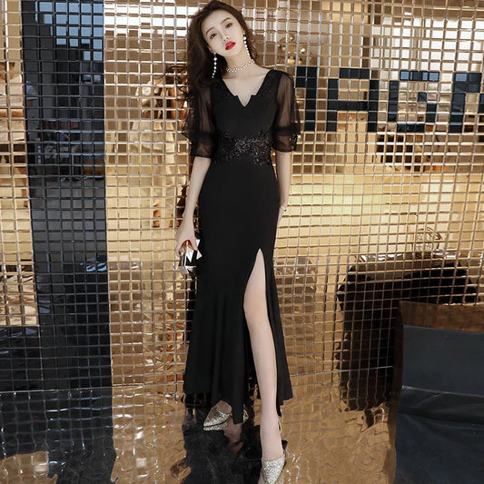 Elegant black evening dress with middle-length sleeves, perfect for formal occasions in the UK