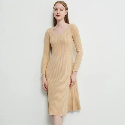 Elegant and cosy midi sweater dress in black, featuring a solid, body-hugging silhouette and comfortable knit fabric