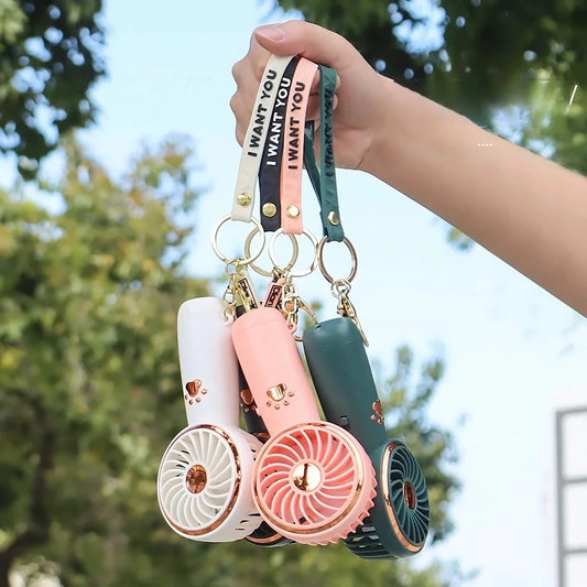Compact, cartoon-themed USB handheld fan for keeping cool during the summer months