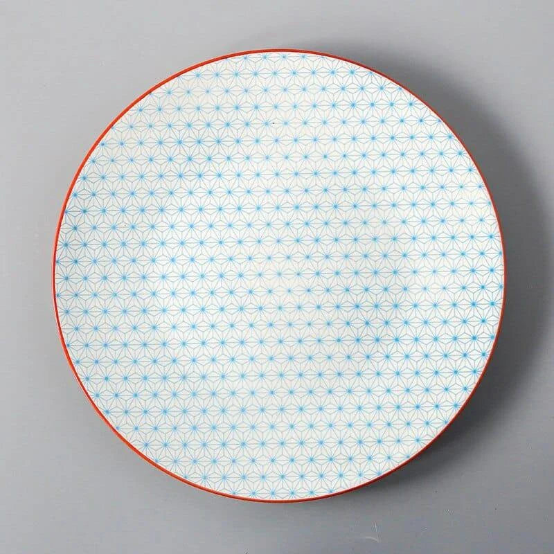 Elegant ceramic plates with vibrant, whimsical prints in a variety of enchanting designs