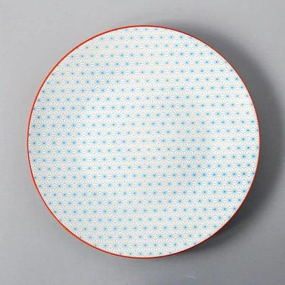 Elegant ceramic plates with vibrant, whimsical prints in a variety of enchanting designs
