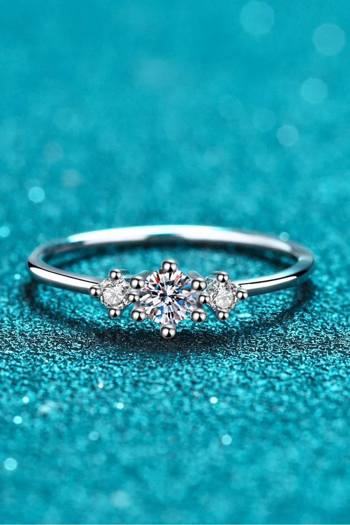 Dazzling sterling silver ring featuring a sparkling moissanite centre stone, perfect for date nights and special occasions.