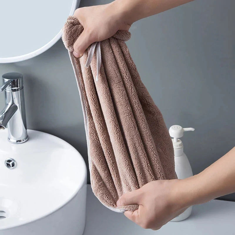 Elegant coral fleece hand towels with a unique bow design, perfect for kitchen and bathroom use