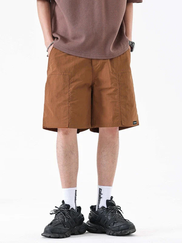 Premium men's quick-drying casual trousers in black, caramel, and sand colours with a relaxed, loose fit