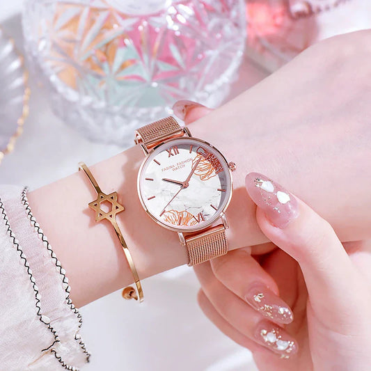 Elegant French ladies' fashion watch with stainless steel case and leather strap, featuring a white dial and classic design