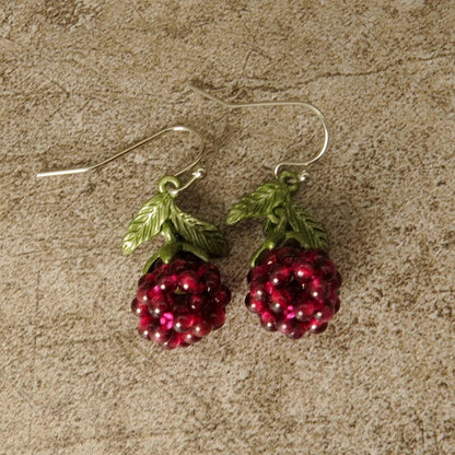 Vintage-style raspberry lacquer earrings with garnet accents, showcasing a charming fruit-shaped silhouette and a captivating retro-inspired design.