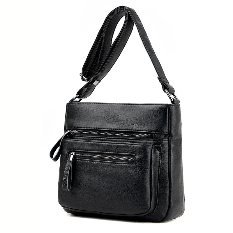 A stylish leather shoulder bag in a modern, box-style design, perfect for busy modern mums.