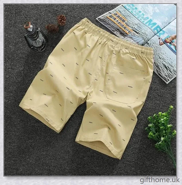Pair of premium cotton beach shorts in navy blue, khaki, and slate grey colours, perfect for stylish seaside adventures
