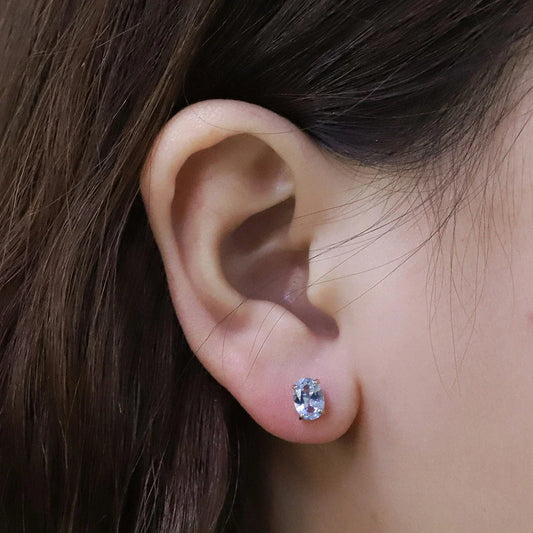 Geometrically simple sterling silver earrings in a rose gold finish, showcasing a minimalist and elegant design
