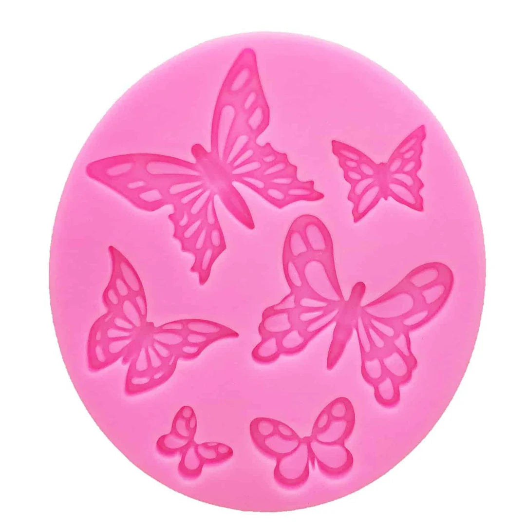 A pink butterfly-shaped silicone fondant mould for creating detailed and intricate fondant decorations