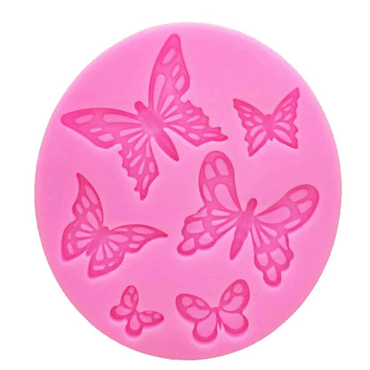 A pink butterfly-shaped silicone fondant mould for creating detailed and intricate fondant decorations