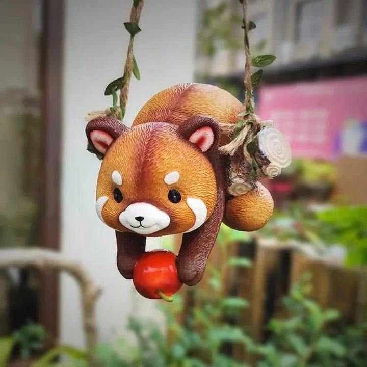 Charming resin raccoon statue climbing a decorative rope, adding a whimsical and nature-inspired touch to your outdoor or indoor spaces