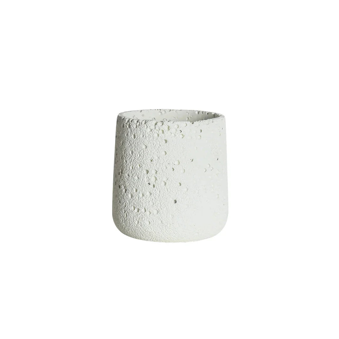 A modern, perforated cement bonsai planter in a Nordic-inspired design, available in various sizes and colours.
