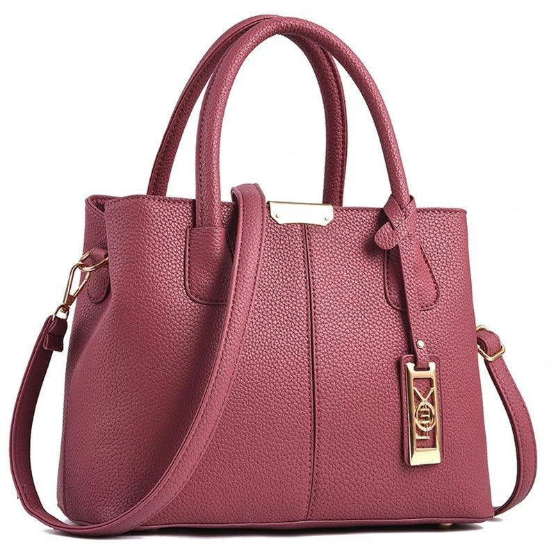 A stylish one-shoulder tote bag in various colours, made of premium polyester with an adjustable strap and spacious interior for the modern professional woman.