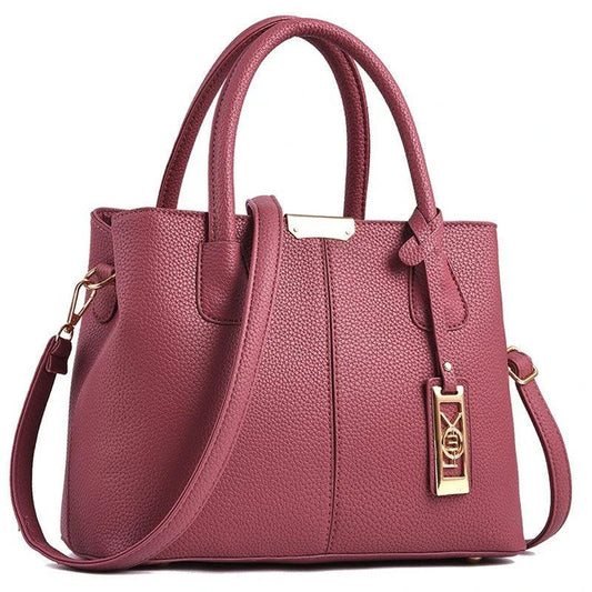 A stylish one-shoulder tote bag in various colours, made of premium polyester with an adjustable strap and spacious interior for the modern professional woman.