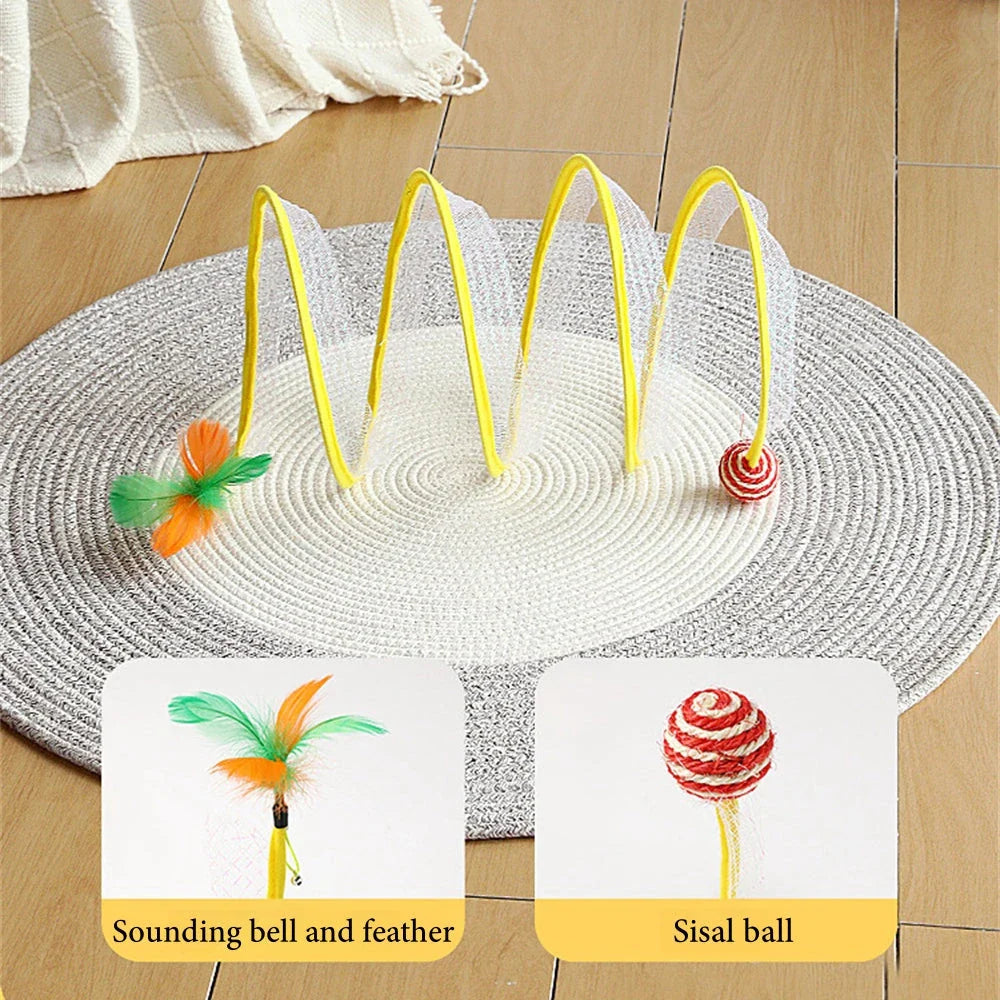 Folding cat play tunnel with various toys like balls, feathers, and mice attached to the sides