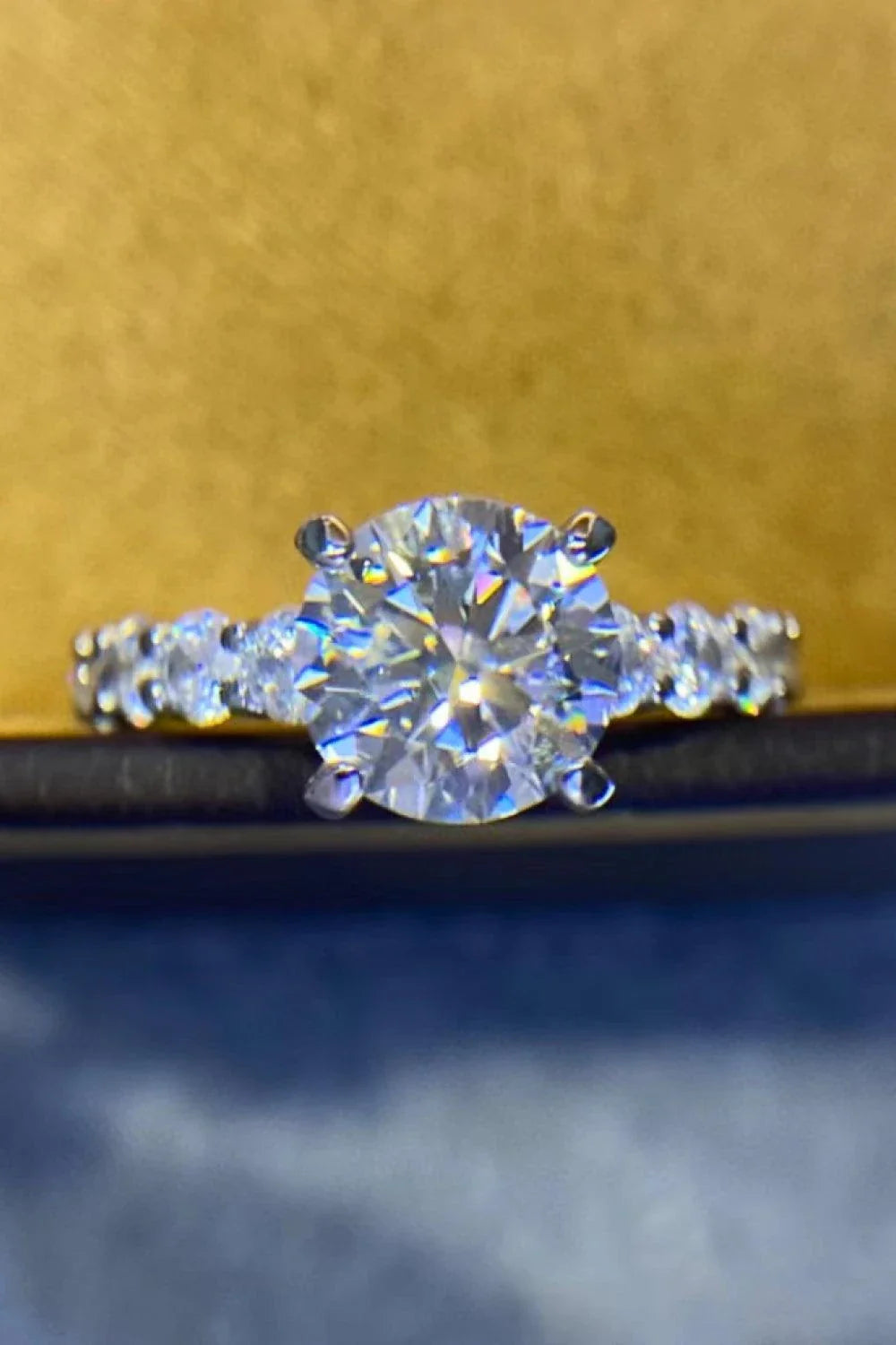 Exquisite 2-carat moissanite solitaire ring in 925 sterling silver, featuring a mesmerising centre stone and delicate metalwork for a modern, minimalist design.