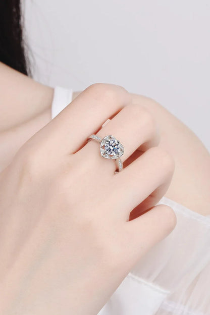 Elegant moissanite heart-shaped ring in sterling silver setting with zircon accent stones