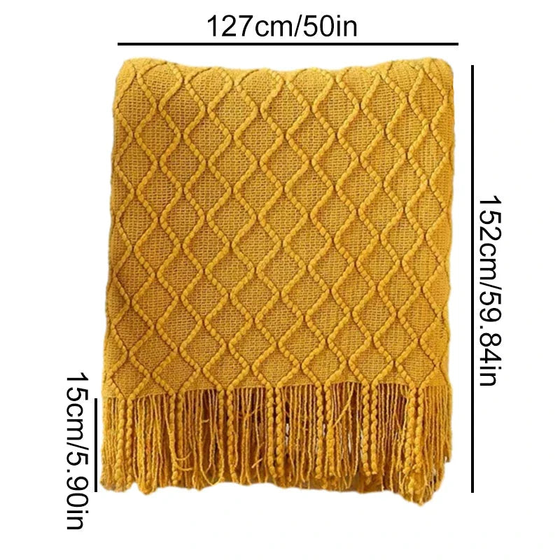 Cosy mustard yellow knitted throw blanket with raised diamond pattern and tassel fringes, providing soft and warm comfort for living rooms, bedrooms, and outdoor use.