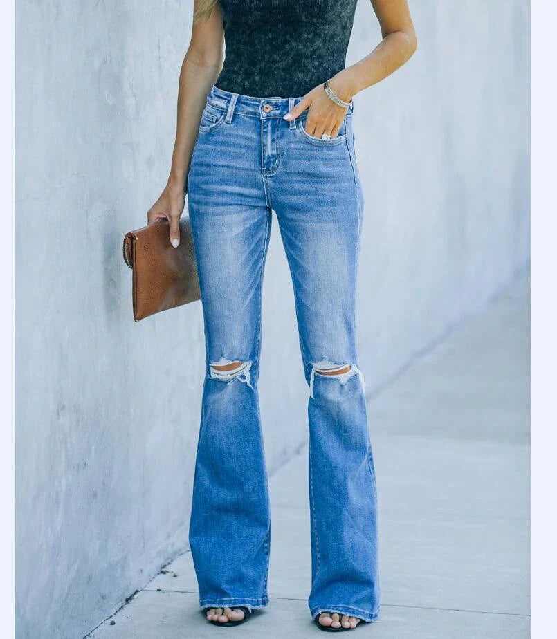 Premium distressed denim trousers for British women, featuring a high-waist silhouette and subtle ripped detailing