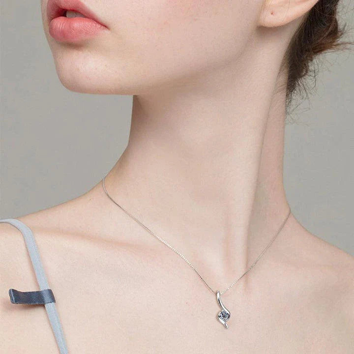 Elegant sterling silver diamond-inspired necklace with a sleek, geometric design