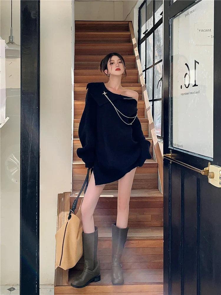 Luxurious off-the-shoulder zipper sweater in black and beige, featuring lantern sleeves and a cozy alpaca wool blend