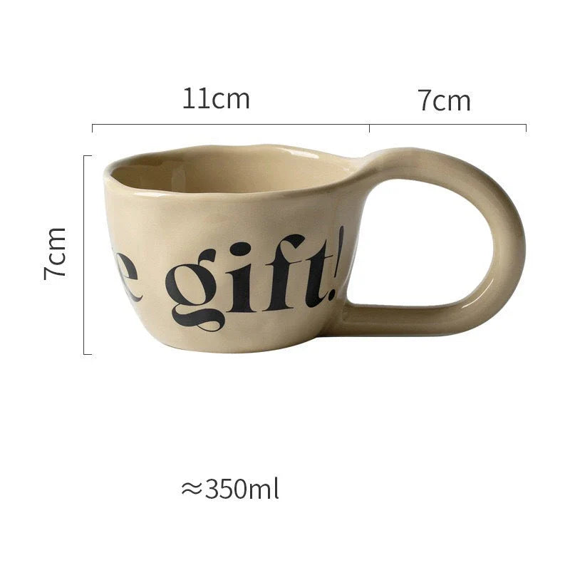 Handcrafted creative alphabet ceramic mug in beige, purple, and khaki colours for hot drinks like coffee and tea